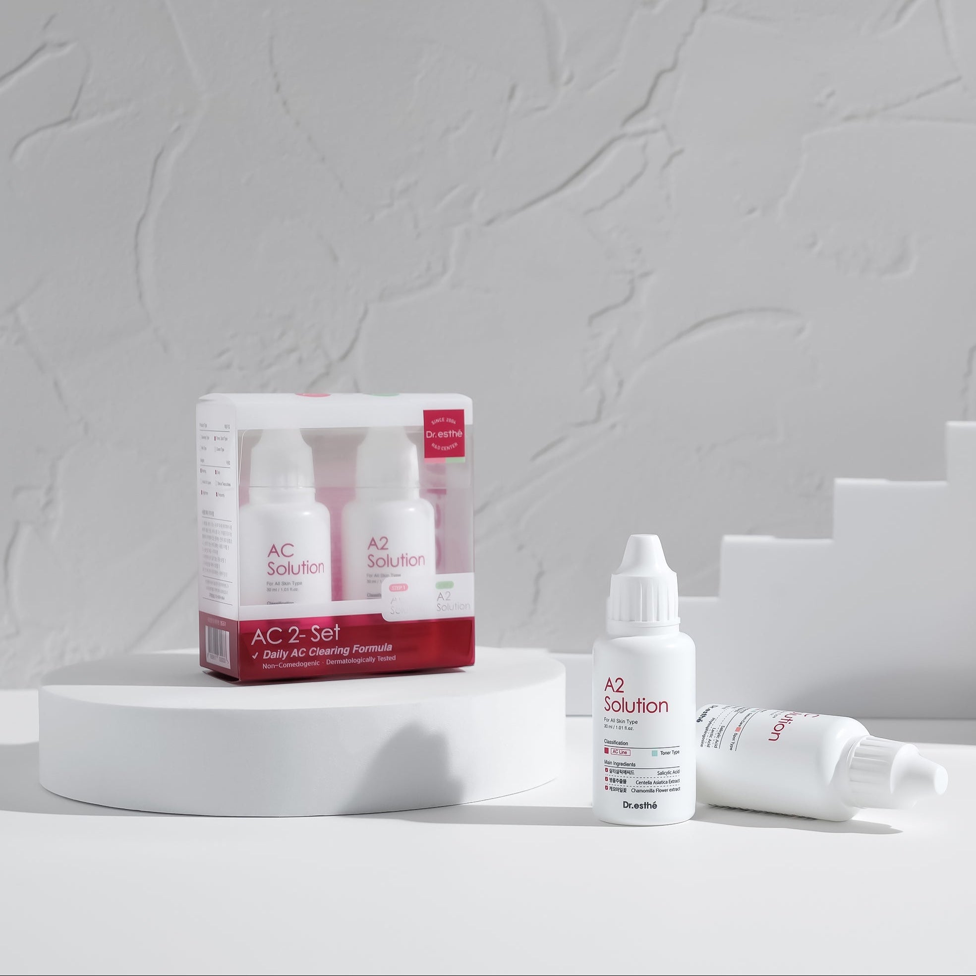 Skincare acne toner solution products with packaging on a neutral background