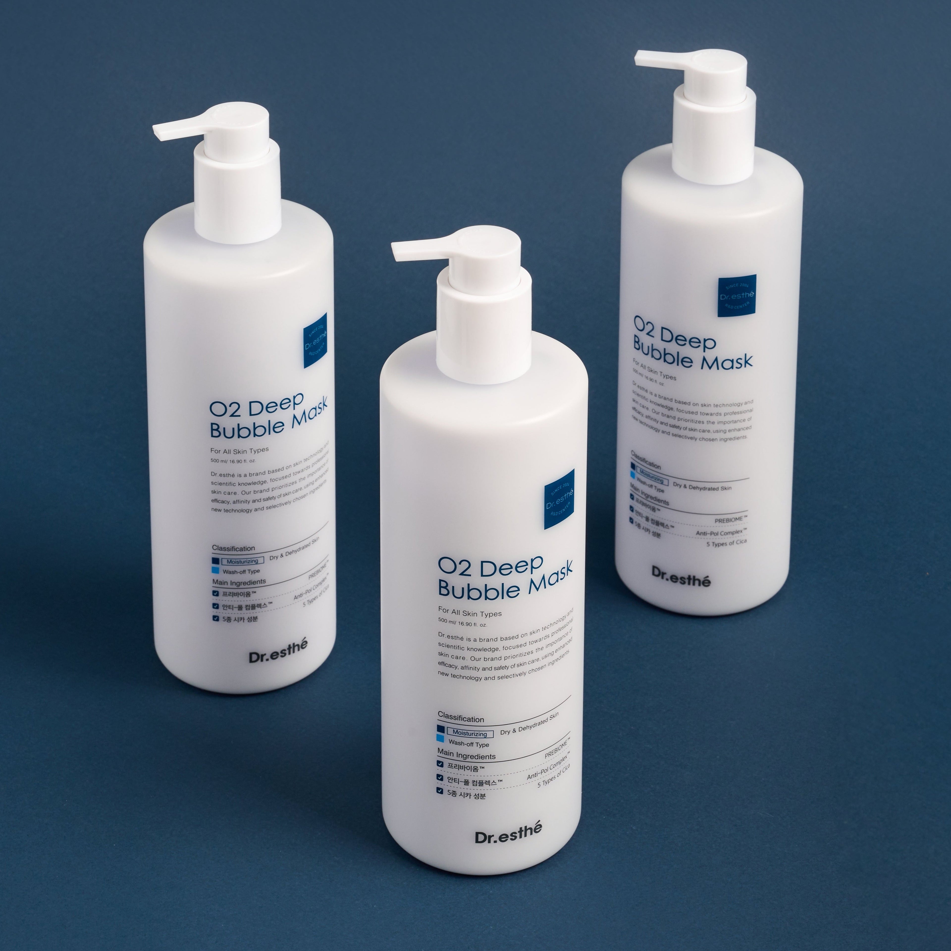 Three bottles of Dr. Esthe O2 Deep Bubble Mask on a blue background